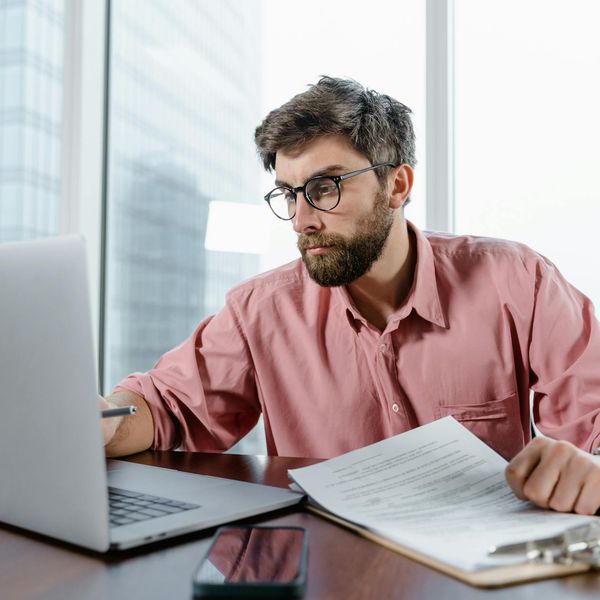 Professional trader analyzing market signals on multiple screens