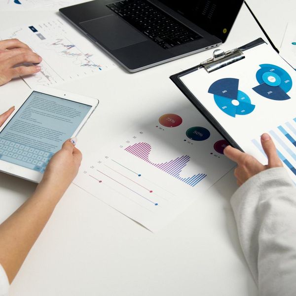 Woman in professional attire analyzing market trends